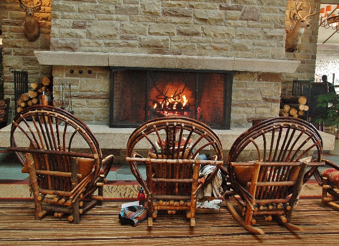 wicker chairs around the fireplace